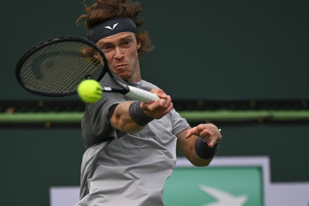 Mar 10, 2024; Indian Wells, CA, USA; Andrey Rublev hits a shot in his third round match against Jiri Lehecka (CZE) during the BNP Paribas Open at Indian Wells Tennis Garden.