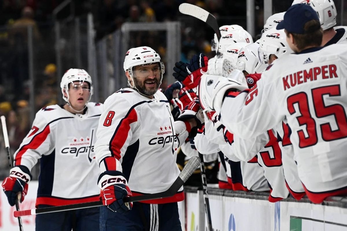 Feb 10, 2024; Boston, Massachusetts, USA; Washington Capitals left wing Alex Ovechkin (8) celebrates with his teammates after scoring a goal against the Boston Bruins during the third period at the TD Garden.