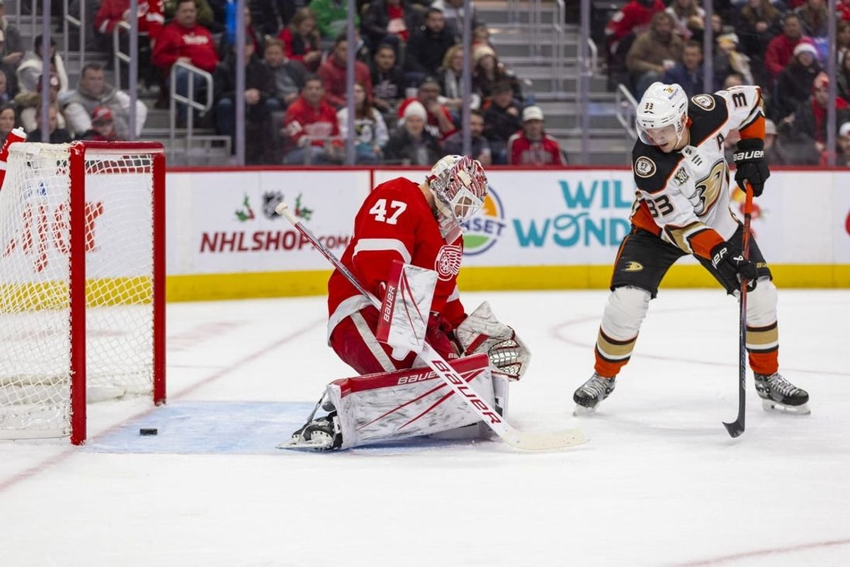 Dec 18, 2023; Detroit, Michigan, USA; The puck slips past Detroit Red Wings goaltender James Reimer (47) during the first period against the Anaheim Ducks at Little Caesars Arena.