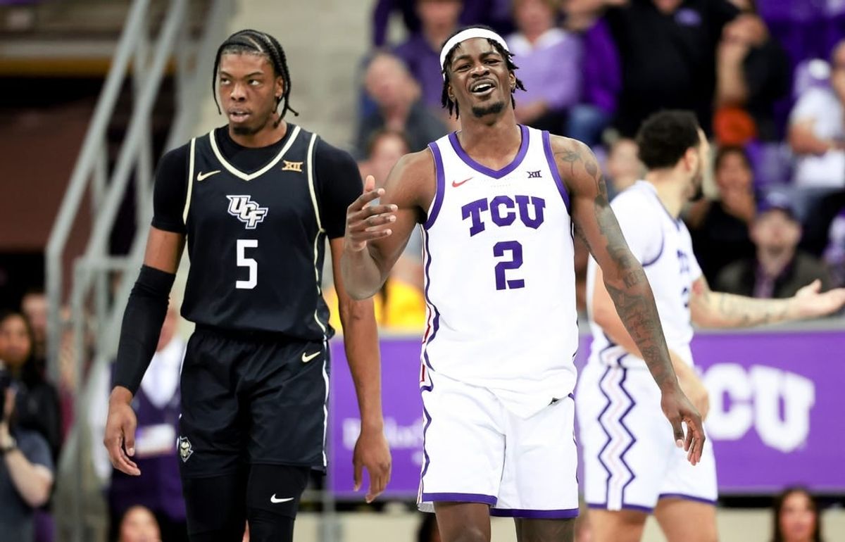 Mar 9, 2024; Fort Worth, Texas, USA; TCU Horned Frogs forward Emanuel Miller (2) reacts in front of UCF Knights forward Omar Payne (5) during the second half at Ed and Rae Schollmaier Arena.
