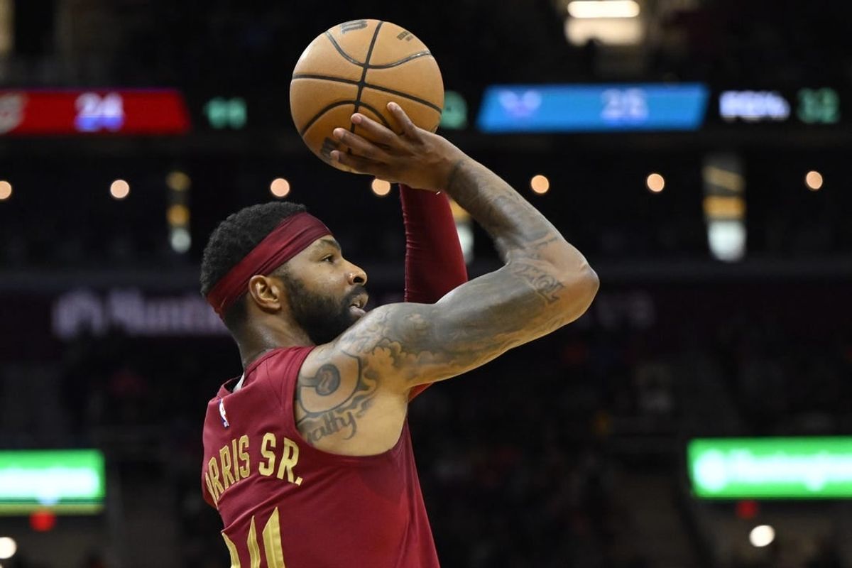 Mar 25, 2024; Cleveland, Ohio, USA; Cleveland Cavaliers forward Marcus Morris Sr. (24) shoots in the second quarter against the Charlotte Hornets at Rocket Mortgage FieldHouse.