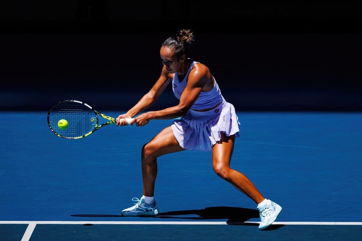 Jan 14, 2024; Melbourne, Victoria, Australia;  Leylah Fernandez of Canada hits a shot against Sarah Bejlek of the Czech Republic in the first round of the women s singles.