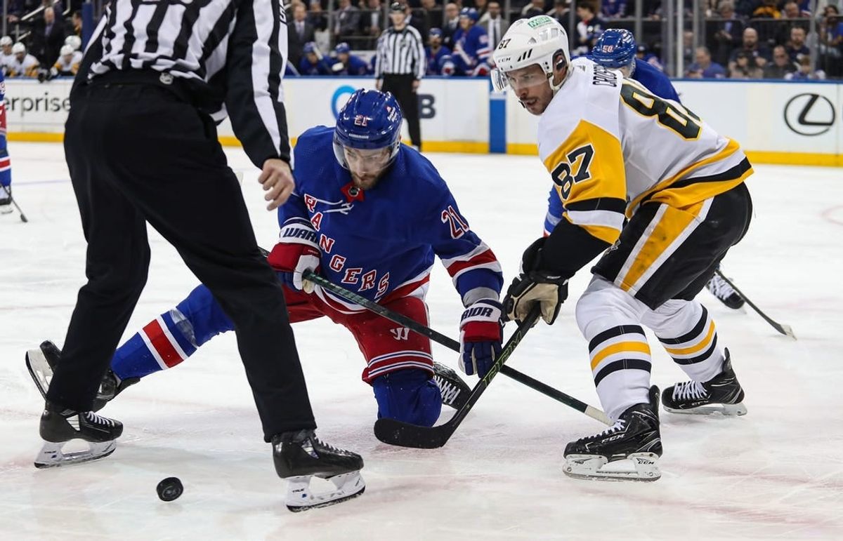 Apr 1, 2024; New York, New York, USA; New York Rangers center Barclay Goodrow (21) and Pittsburgh Penguins center Sidney Crosby (87) battle after a face-off during the second period at Madison Square Garden.