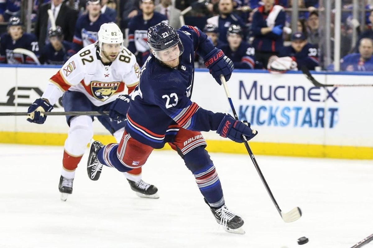 Mar 23, 2024; New York, New York, USA; New York Rangers defenseman Adam Fox (23) attempts a shot on goal in the second period against the Florida Panthers at Madison Square Garden.