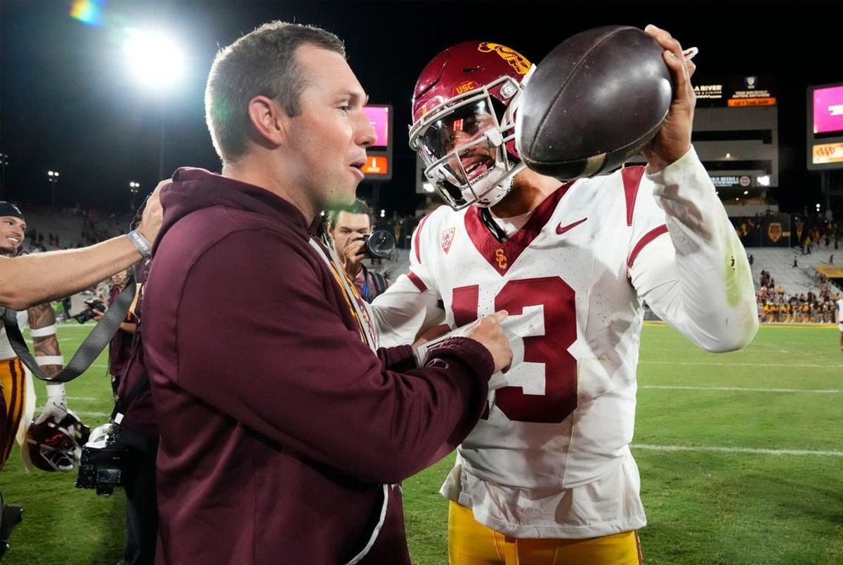 Arizona State Sun Devils head coach Kenny Dillingham congratulates USC Trojans quarterback Caleb Williams (13) on his 42-28 win at Mountain America Stadium on Sep 23, 2023.