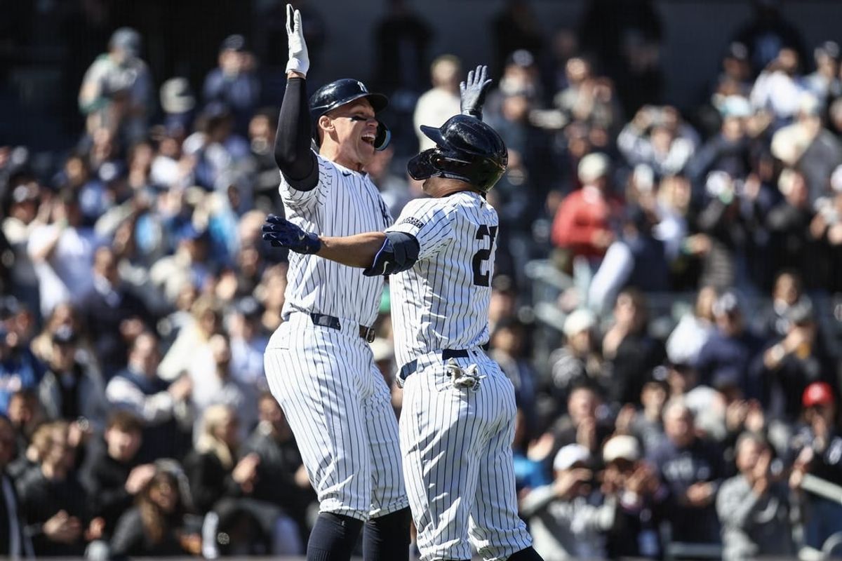 Apr 7, 2024; Bronx, New York, USA; New York Yankees designated hitter Giancarlo Stanton (27) is greeted by center fielder Aaron Judge (99) after hitting a grand slam home run in the third inning against the Toronto Blue Jays at Yankee Stadium.