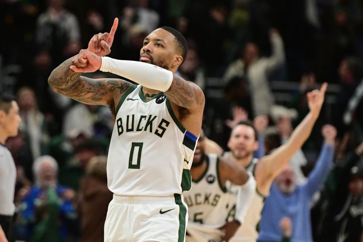 Jan 14, 2024; Milwaukee, Wisconsin, USA;  Milwaukee Bucks guard Damian Lillard (0) reacts after scoring the game-winning basket in overtime against the Sacramento Kings at Fiserv Forum.