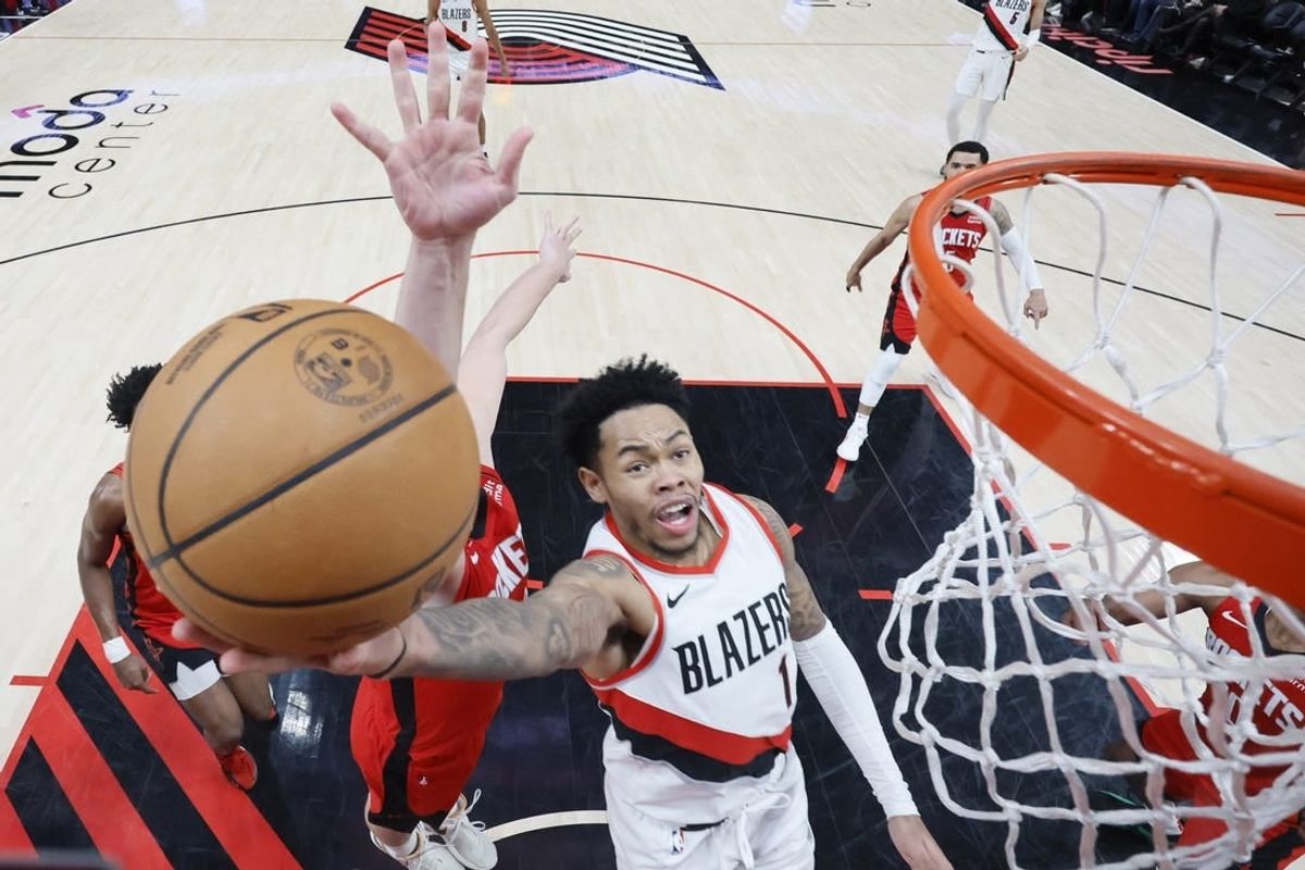 Mar 8, 2024; Portland, Oregon, USA; Portland Trail Blazers shooting guard Anfernee Simons (1) shoots the ball past Houston Rockets center Alperen Sengun (28) during the second half at Moda Center.