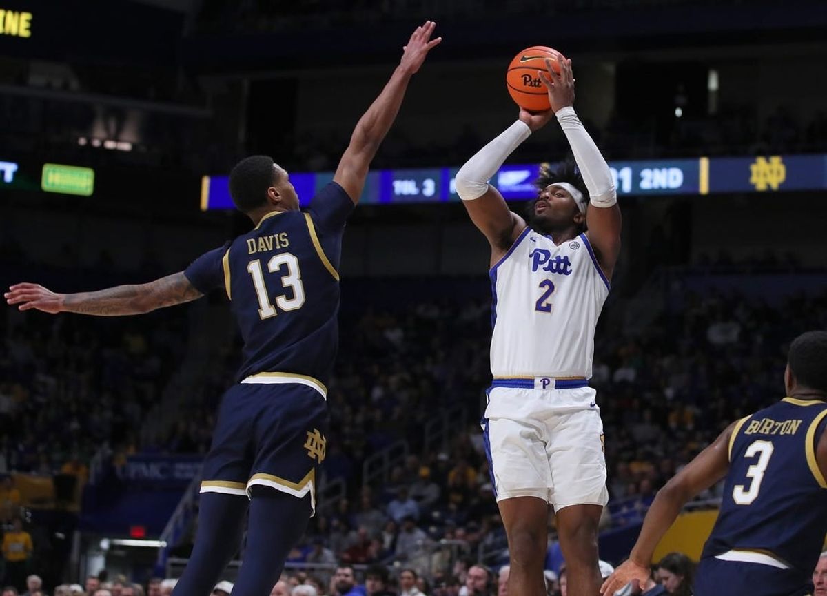 Pittsburgh Panthers Blake Hinson (2) attempts a three point shot over the head of Notre Dame Fighting Irish Tae Davis (13) during the second half on February 3, 2024 at the Petersen Events Center in Pittsburgh, PA.