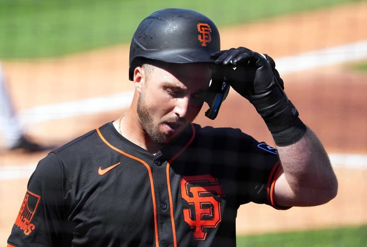 Mar 11, 2024; Surprise, Arizona, USA; San Francisco Giants designated hitter Joey Bart (21) reacts after striking out against the Kansas City Royals during the second inning at Surprise Stadium.