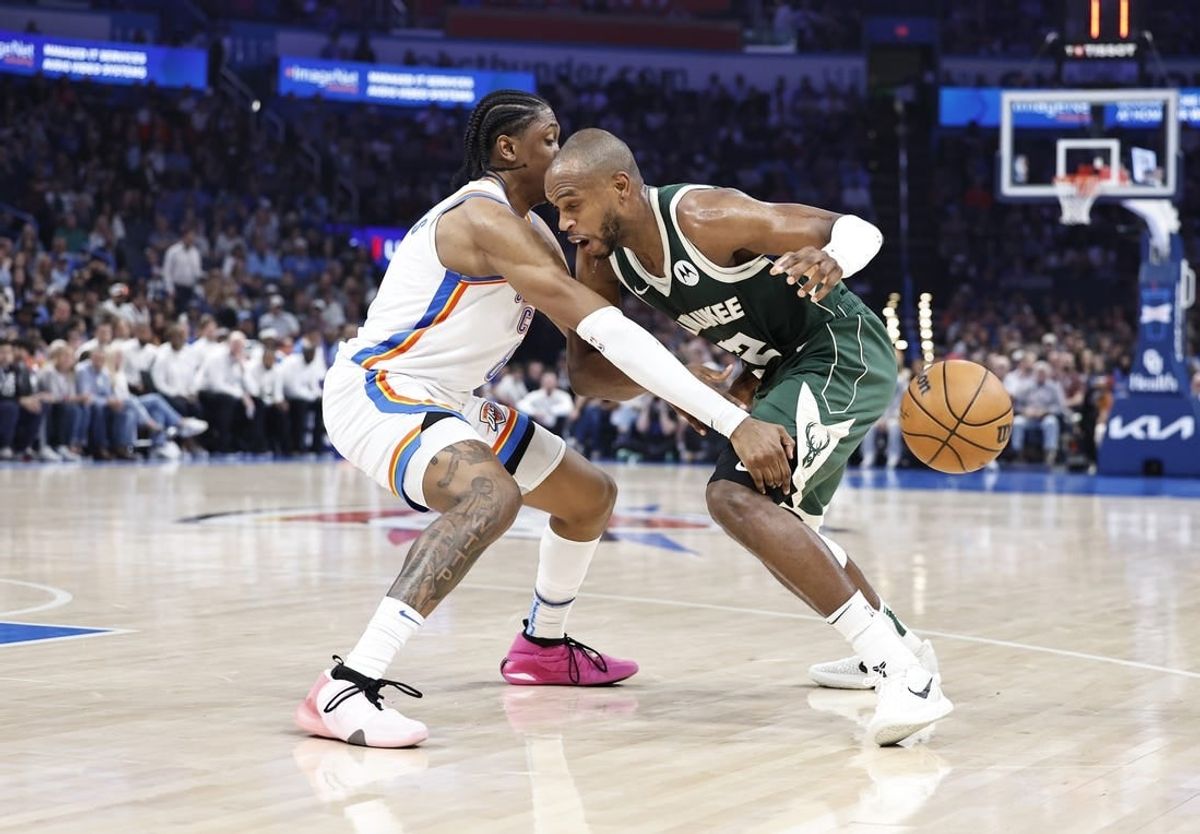 Apr 12, 2024; Oklahoma City, Oklahoma, USA; Oklahoma City Thunder forward Jalen Williams (8) causes Milwaukee Bucks forward Khris Middleton (22) to lose control of the ball during the second quarter at Paycom Center.