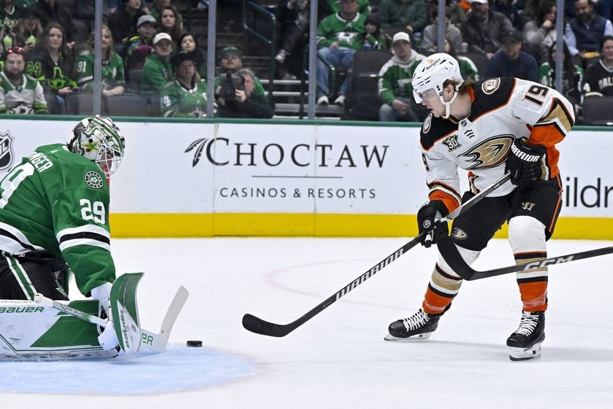 Jan 25, 2024; Dallas, Texas, USA; Dallas Stars goaltender Jake Oettinger (29) stops a shot by Anaheim Ducks right wing Troy Terry (19) during the first period at the American Airlines Center.