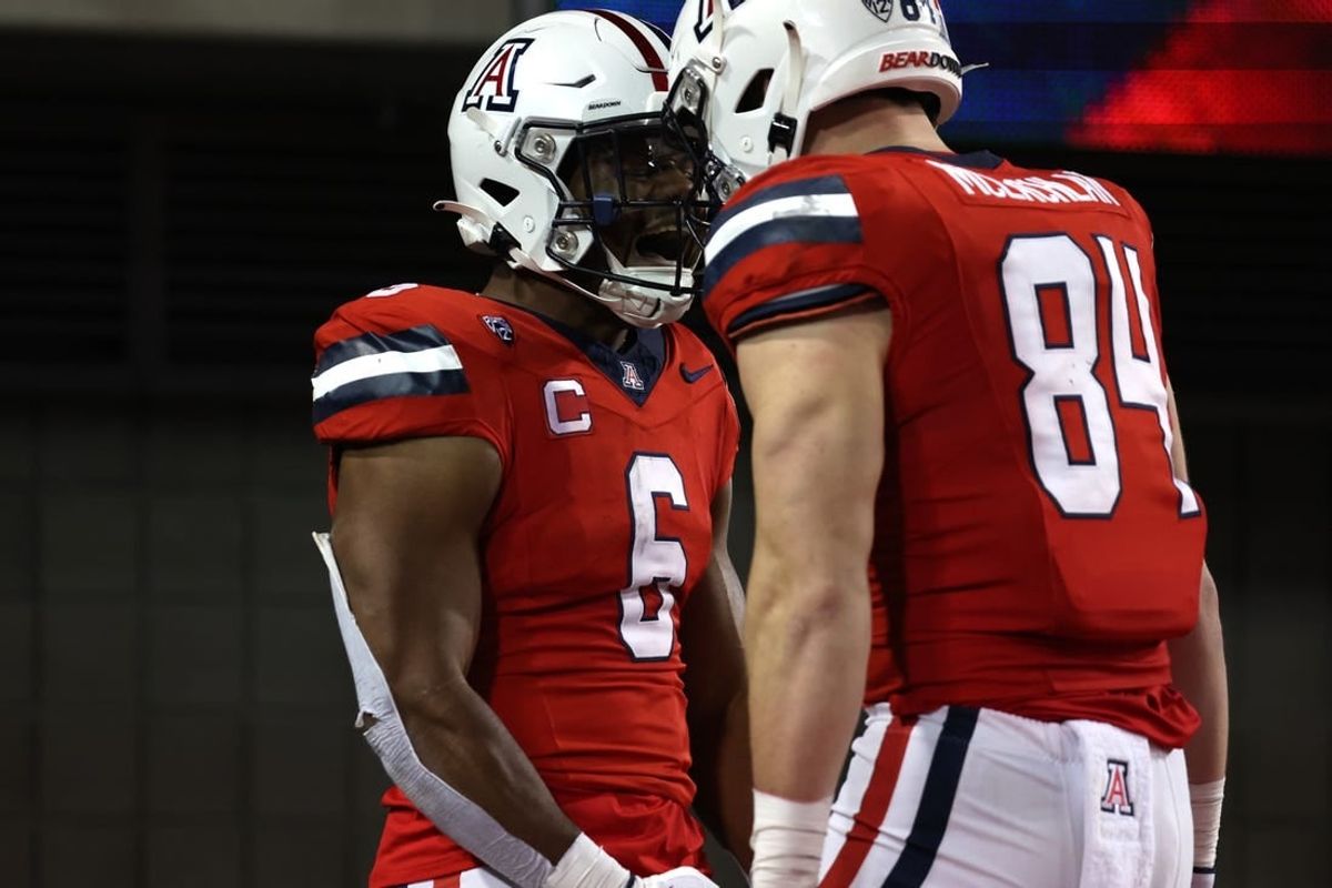 Oct 28, 2023; Tucson, Arizona, USA; Arizona Wildcats running back Michael Wiley #6 celebrates a touchdown with tight end Tanner McLachlan #84 during the second half at Arizona Stadium.
