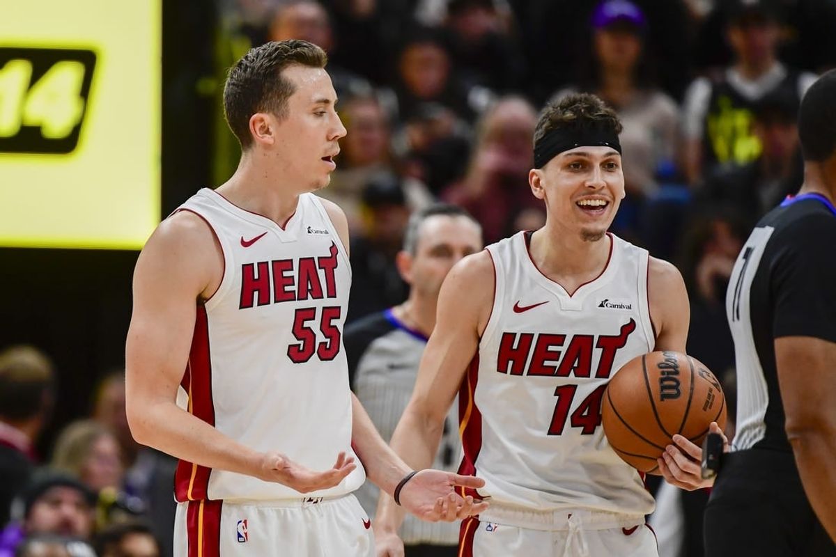 Dec 31, 2022; Salt Lake City, Utah, USA; Miami Heat forward Duncan Robinson (55) and guard Tyler Herro (14) react after a call against the Utah Jazz during the second half at Vivint Arena.