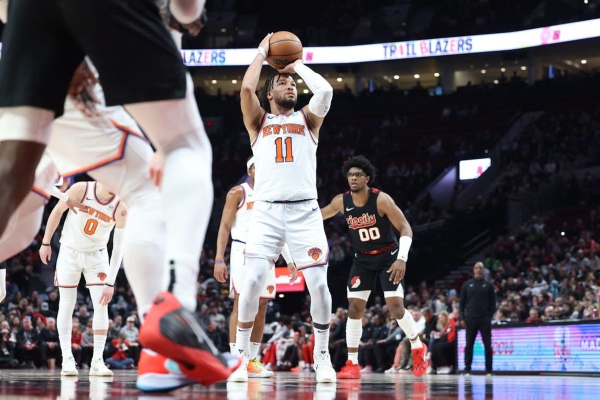 Mar 14, 2024; Portland, Oregon, USA; New York Knicks guard Jalen Brunson (11) shoots a free throw as Portland Trail Blazers guard Scoot Henderson (00) watches in the fourth quarter at Moda Center.