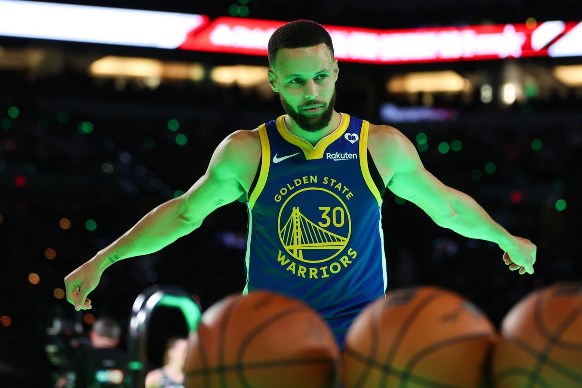 Stephen Curry of the Golden State Warriors participates in a 3-point challenge against Sabrina Ionescu of the New York Liberty during the State Farm All-Star Saturday Night at Lucas Oil Stadium on Feb. 17, 2024.