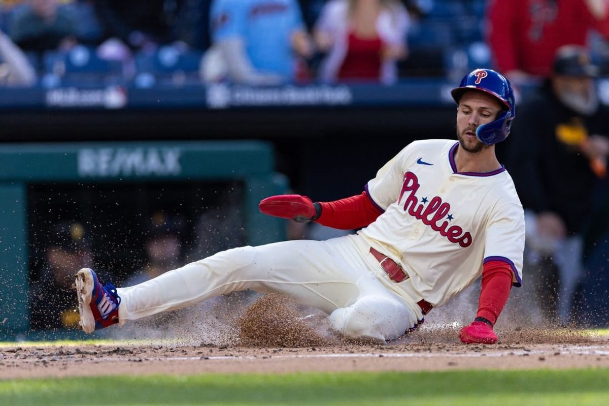 Apr 13, 2024; Philadelphia, Pennsylvania, USA; Philadelphia Phillies shortstop Trea Turner (7) scores against the Pittsburgh Pirates during the first inning at Citizens Bank Park.