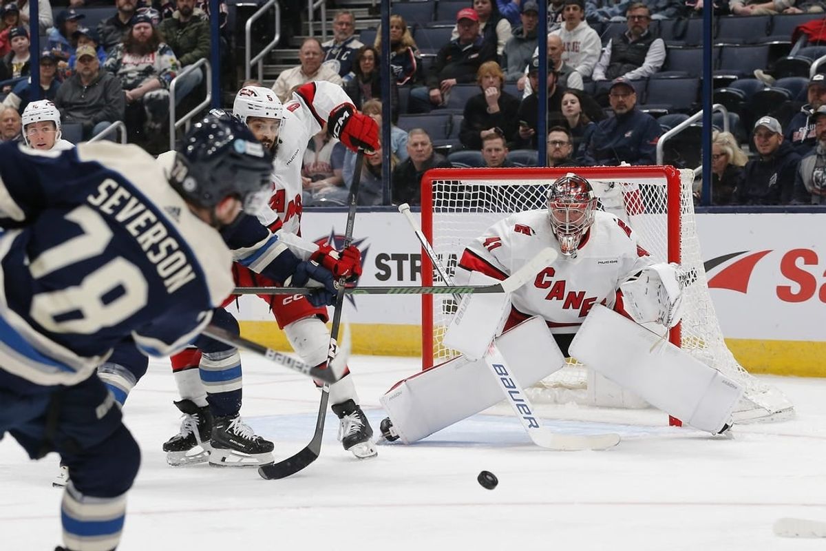 Feb 29, 2024; Columbus, Ohio, USA; Carolina Hurricanes goalie Spencer Martin (41) awaits the shot attempt from Columbus Blue Jackets defenseman Damon Severson (78) during the first period at Nationwide Arena.