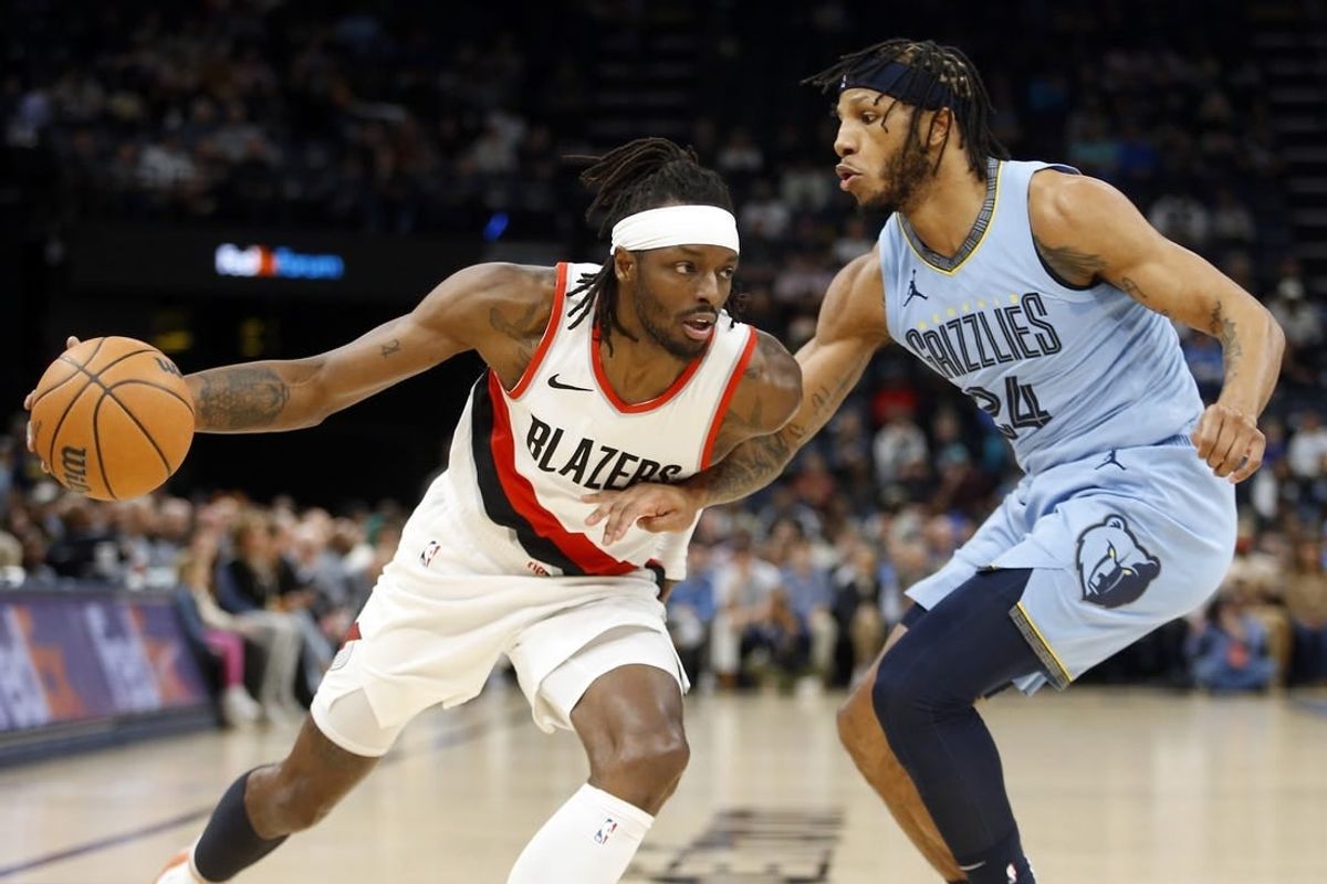 Mar 2, 2024; Memphis, Tennessee, USA; Portland Trail Blazers forward Jerami Grant (9) drives to the basket as Memphis Grizzlies forward Lamar Stevens (24) defends during the first half at FedExForum.
