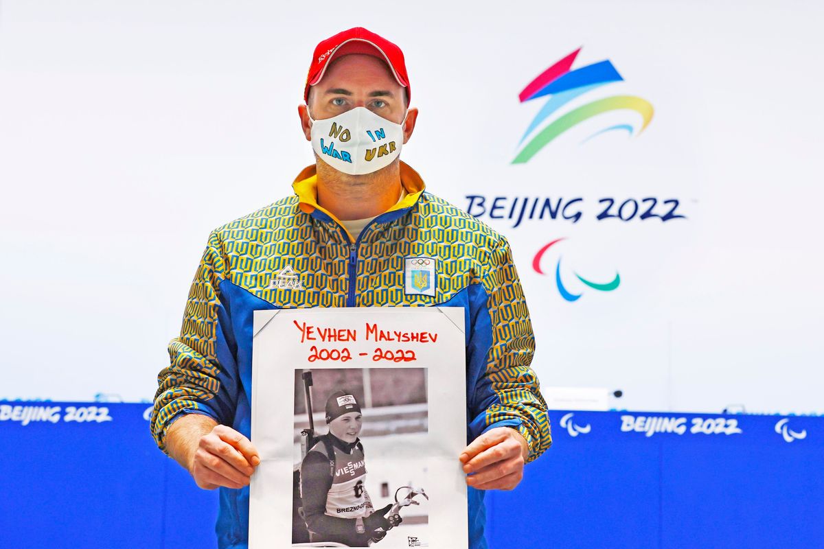 Lee  Reaney,  a  journalist  working  for  the  Kyiv  Post,  holds  a  photo  of  Yevhen  Malyshev,  a  biathlete  who  was  killed  in  a  Russian  bombing  in  Kharkiiv.
