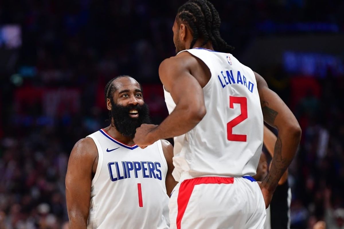 Jan 21, 2024; Los Angeles, California, USA; Los Angeles Clippers guard James Harden (1) reacts after forward Kawhi Leonard (2) scores three point basket against the Brooklyn Nets during the second half at Crypto.com Arena.