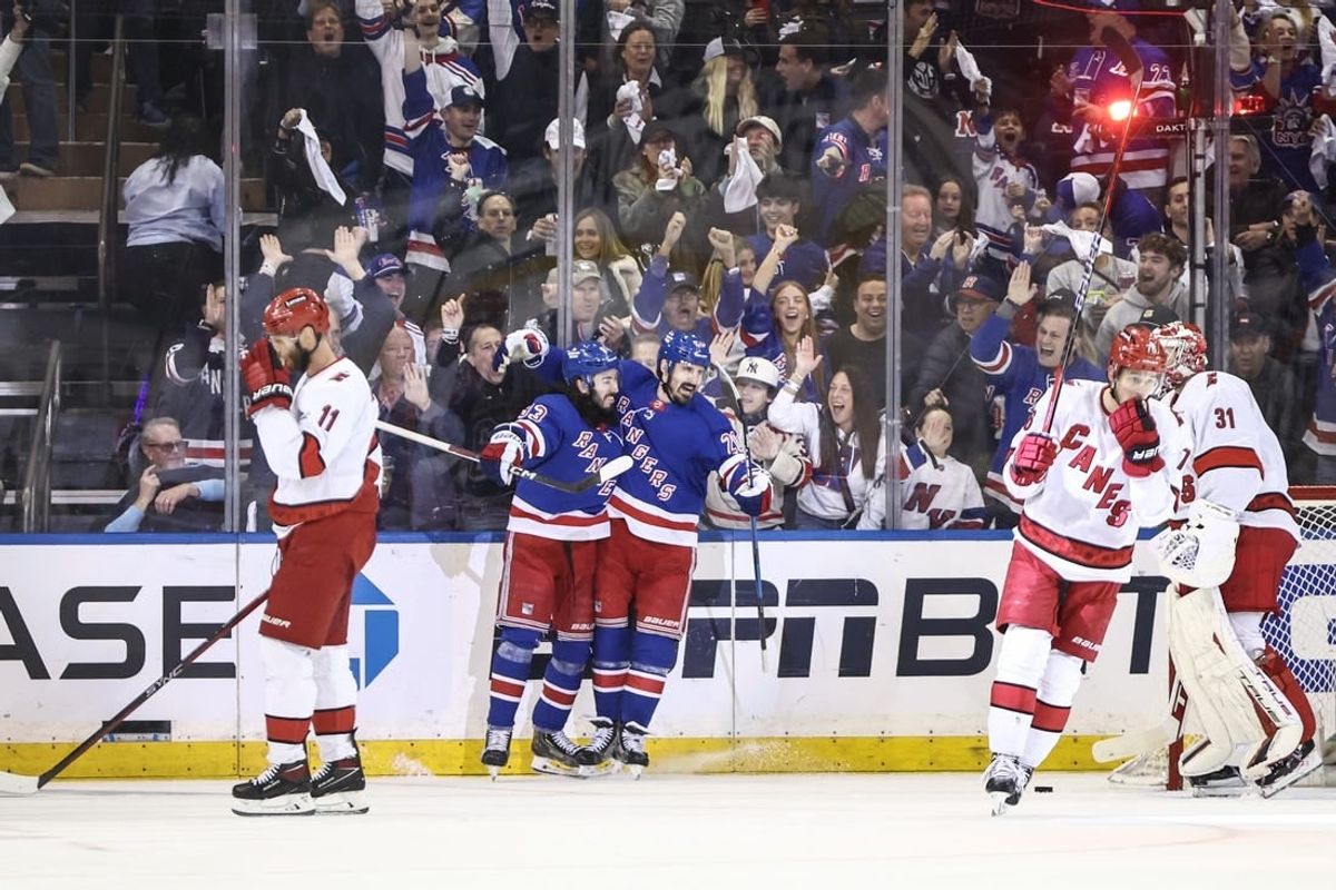 May 5, 2024; New York, New York, USA; New York Rangers center Mika Zibanejad (93) celebrates with New York Rangers left wing Chris Kreider (20) after scoring his second goal of the game in the first period against the Carolina Hurricanes in game one of the second round of the 2024 Stanley Cup Playoffs at Madison Square Garden.
