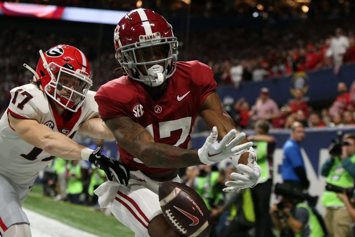Dec 2, 2023; Atlanta, GA, USA; Alabama Crimson Tide wide receiver Isaiah Bond (17) attempts to make a catch against Georgia Bulldogs defensive back Dan Jackson (17) during the first half of the SEC Championship game at Mercedes-Benz Stadium.
