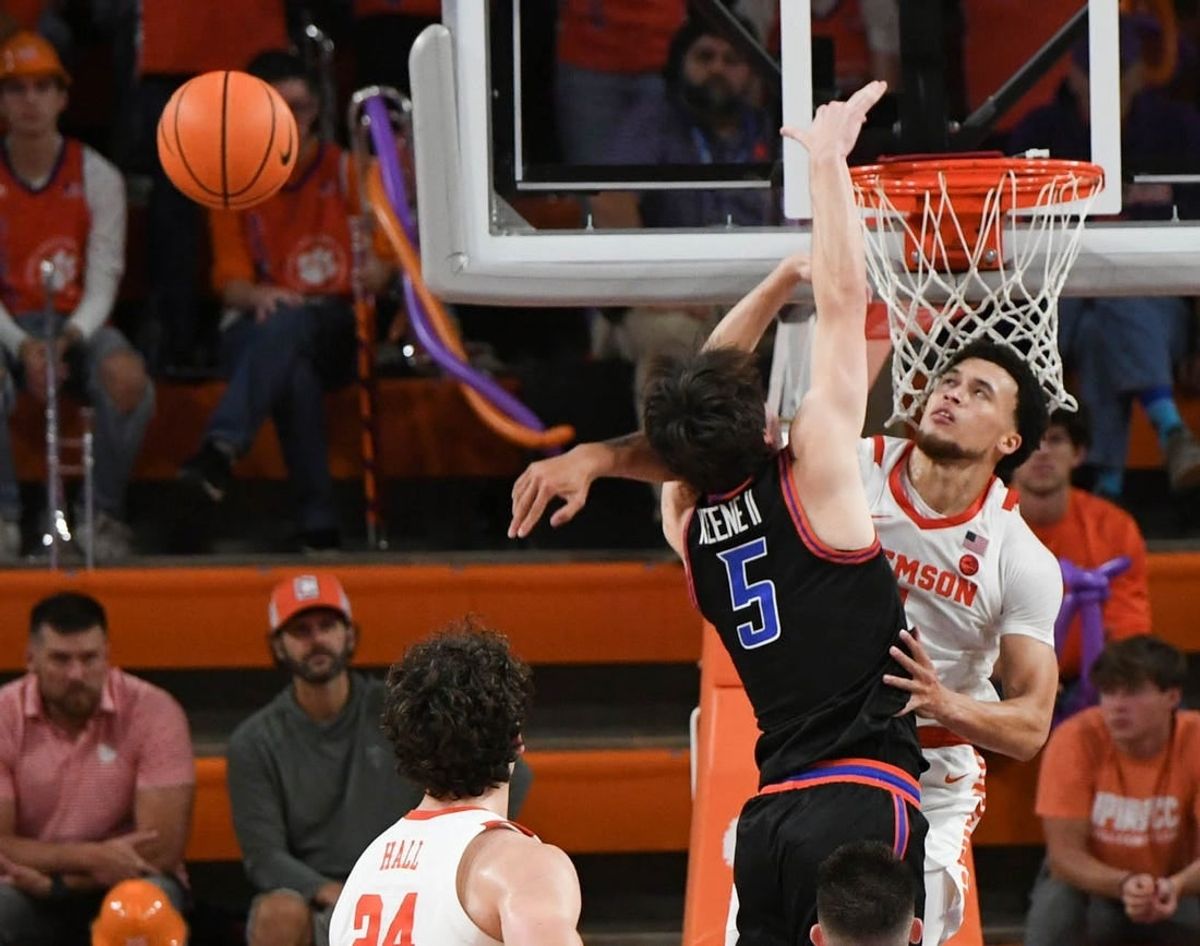Sunday, November 19, 2023; Pickens County, SC; Clemson senior guard Chase Hunter (1) blocks the shot of Boise State guard RJ Keene (5) during the second half at Littlejohn Coliseum.