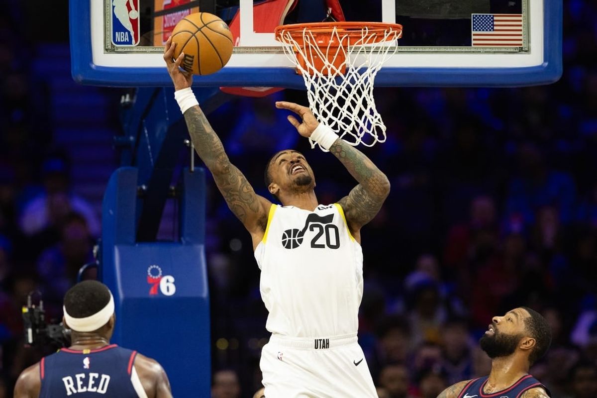 Jan 6, 2024; Philadelphia, Pennsylvania, USA; Utah Jazz forward John Collins (20) scores against the Philadelphia 76ers during the second quarter at Wells Fargo Center.