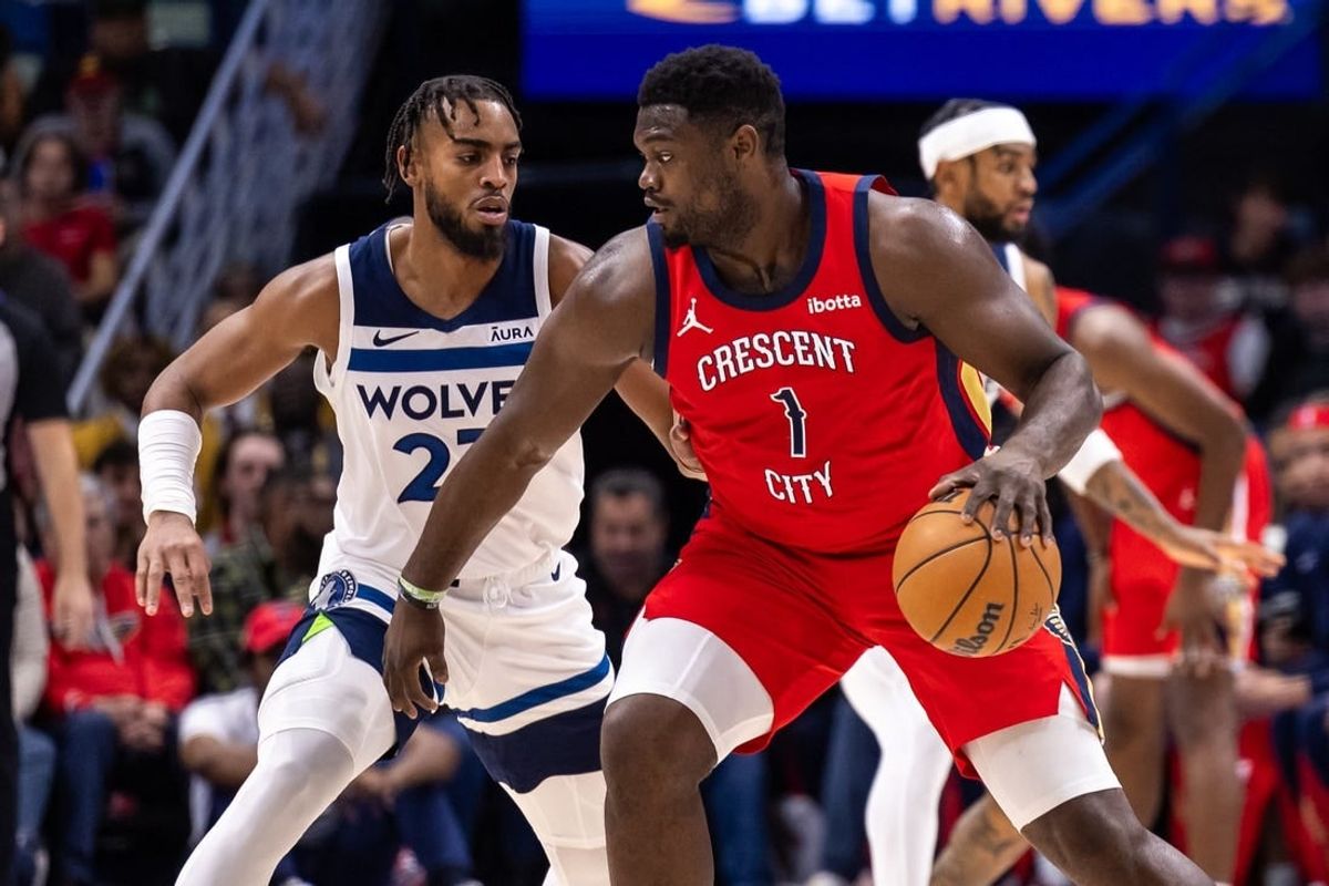 Dec 11, 2023; New Orleans, Louisiana, USA; New Orleans Pelicans forward Zion Williamson (1) dribbles against Minnesota Timberwolves forward Troy Brown Jr. (23) during the first half at the Smoothie King Center.