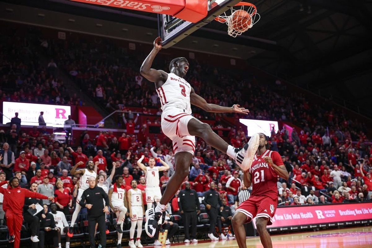 Jan 9, 2024; Piscataway, New Jersey, USA; Rutgers Scarlet Knights forward Mawot Mag (3) dunks the ball in front of Indiana Hoosiers forward Mackenzie Mgbako (21) during the second half at Jersey Mike's Arena.