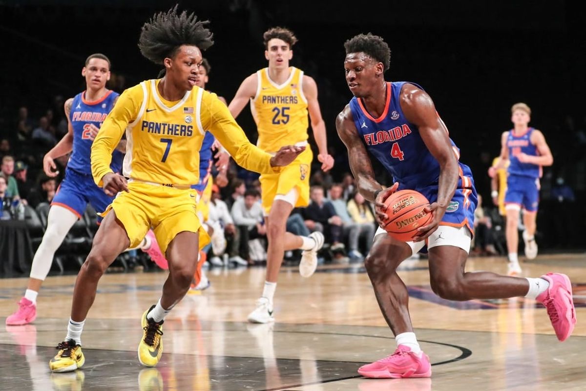 Nov 22, 2023; Brooklyn, New York, USA;  Florida Gators forward Tyrese Samuel (4) and Pittsburgh Panthers guard Carlton Carrington (7) at Barclays Center.