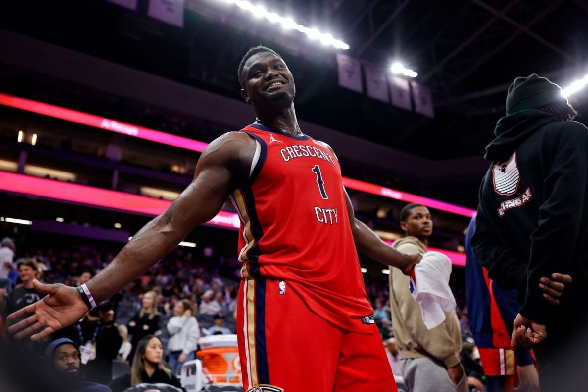Apr 2, 2024; Sacramento, California, USA; New Orleans Pelicans forward Zion Williamson (1) smiles to a fan during the fourth quarter against the Sacramento Kings at Golden 1 Center.