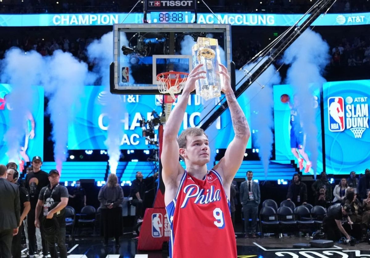 Feb 18, 2023; Salt Lake City, UT, USA; Philadelphia 76ers guard Mac McClung (9) celebrates with the trophy after winning the Dunk Contest during the 2023 All Star Saturday Night at Vivint Arena.