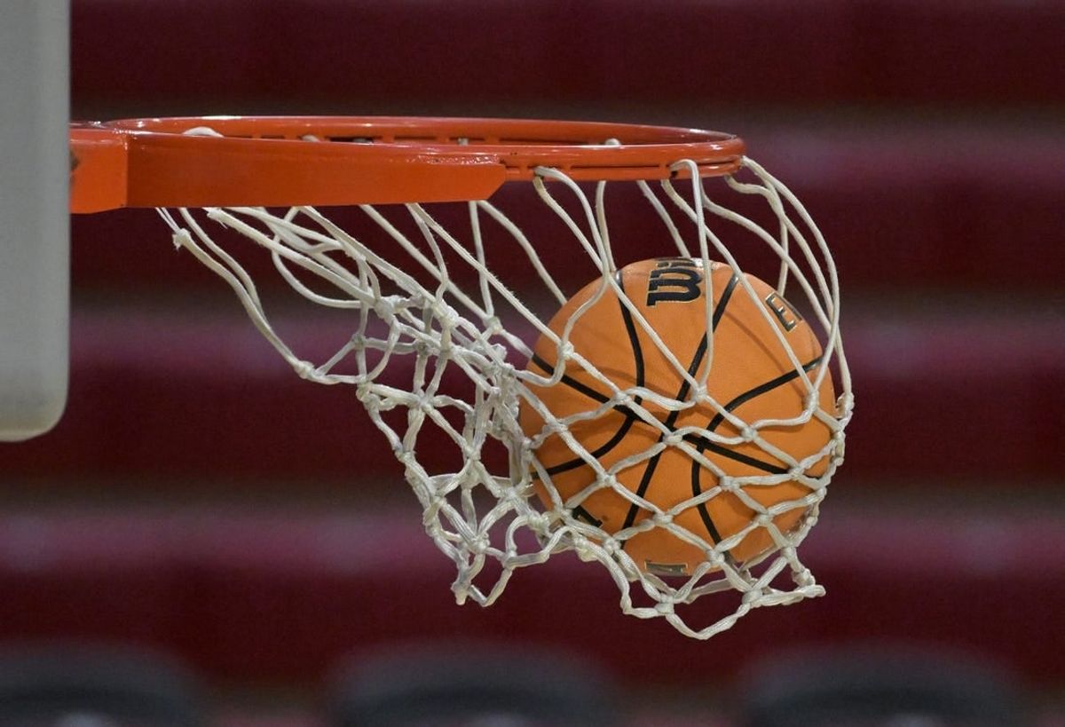 Dec 22, 2023; Los Angeles, California, USA; Detailed view of a basketball going through the net during a game between the Loyola Marymount Lions and the Colorado State Rams at Gersten Pavilion.