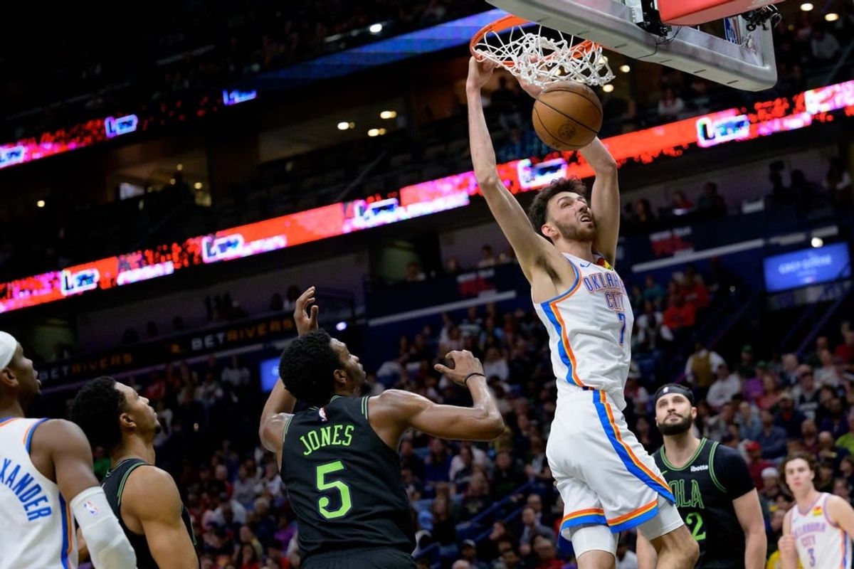 Mar 26, 2024; New Orleans, Louisiana, USA; Oklahoma City Thunder forward Chet Holmgren (7) dunks against New Orleans Pelicans forward Herbert Jones (5) during the first half at Smoothie King Center.