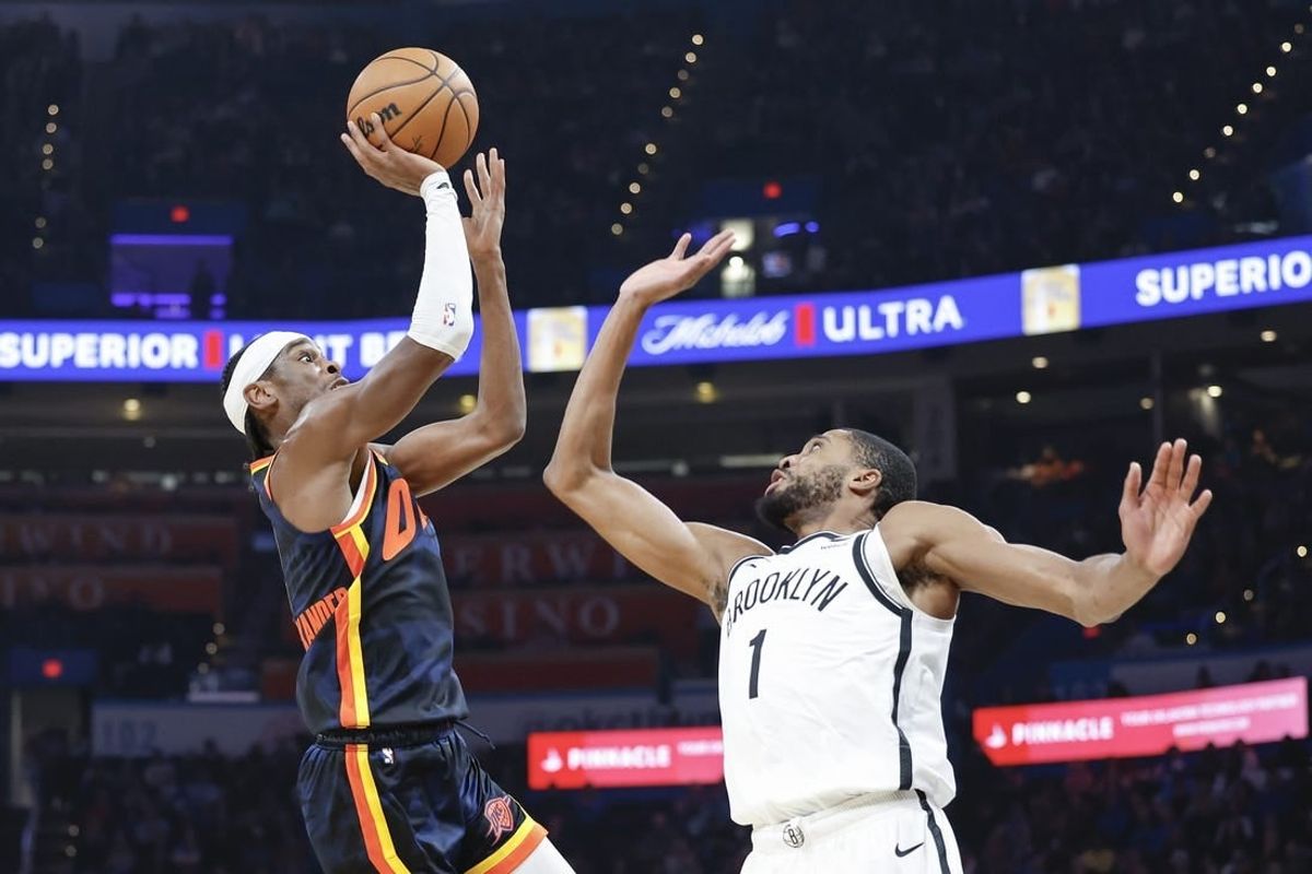 Dec 31, 2023; Oklahoma City, Oklahoma, USA; Oklahoma City Thunder guard Shai Gilgeous-Alexander (2) shoots as Brooklyn Nets forward Mikal Bridges (1) defends during the second quarter at Paycom Center.