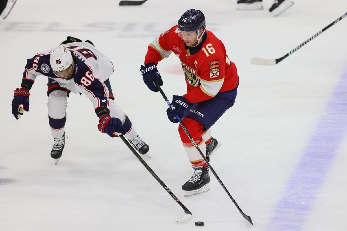 Apr 11, 2024; Sunrise, Florida, USA; Florida Panthers center Aleksander Barkov (16) moves the puck against Columbus Blue Jackets right wing Kirill Marchenko (86) during the first period at Amerant Bank Arena.