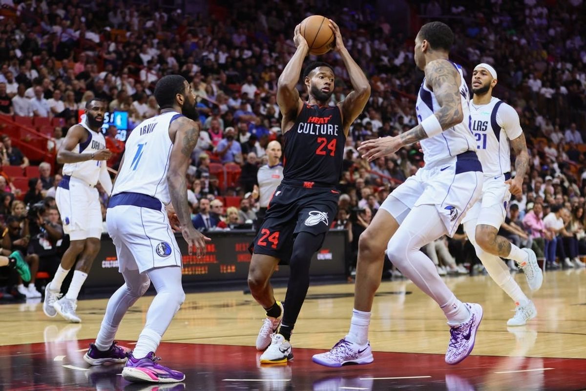 Apr 10, 2024; Miami, Florida, USA; Miami Heat forward Haywood Highsmith (24) drives to the basket against the Dallas Mavericks during the second quarter at Kaseya Center.