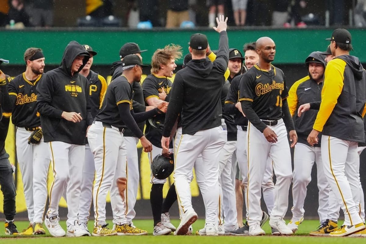 May 4, 2024; Pittsburgh, Pennsylvania, USA; Pittsburgh Pirates left fielder Jack Suwinski (65) is congratulated by teammates for hitting a walk off RBI single against the Colorado Rockies during the ninth inning at PNC Park.