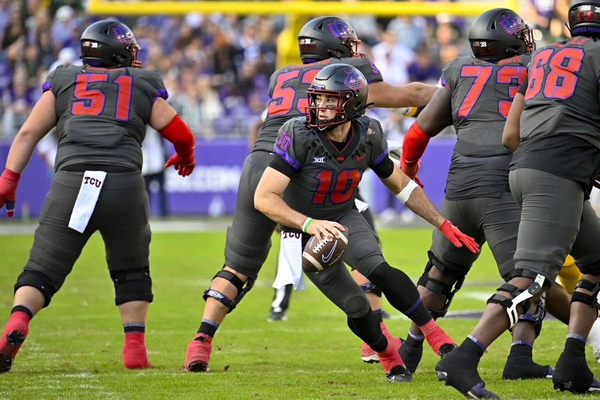 Nov 18, 2023; Fort Worth, Texas, USA; TCU Horned Frogs quarterback Josh Hoover (10) runs with the ball against the Baylor Bears during the first half at Amon G. Carter Stadium.