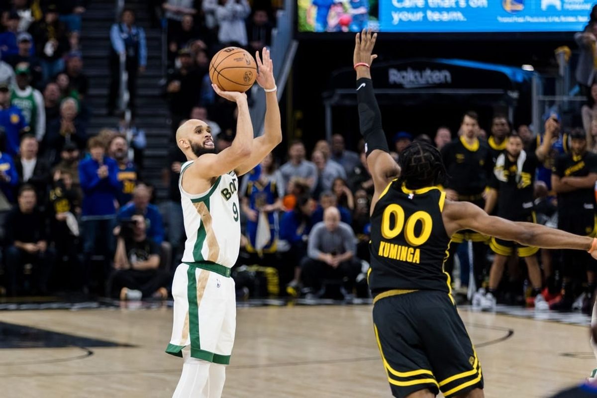 Dec 19, 2023; San Francisco, California, USA; Boston Celtics guard Derrick White (9) shoots over Golden State Warriors forward Jonathan Kuminga (00) during the second half at Chase Center.