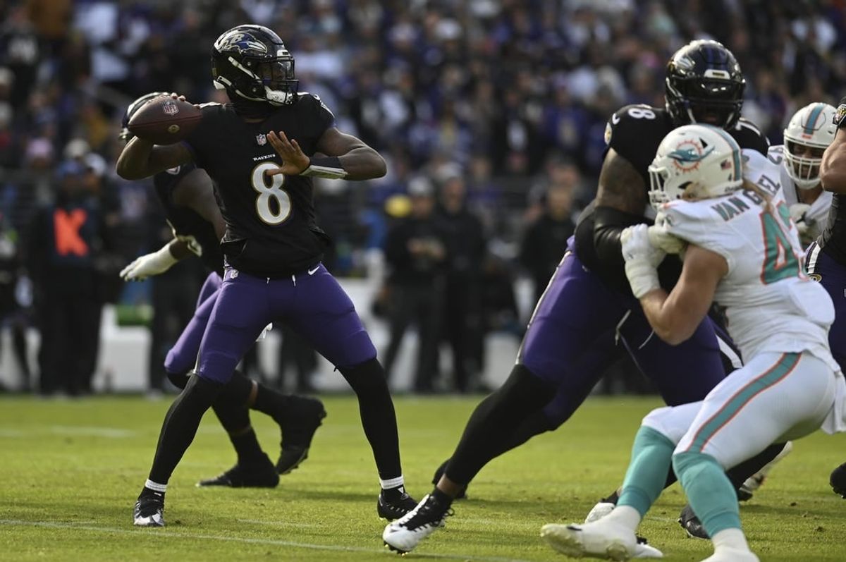 Dec 31, 2023; Baltimore, Maryland, USA;  Baltimore Ravens quarterback Lamar Jackson (8) throws from the pocket during the first half against the Miami Dolphins at M&T Bank Stadium.