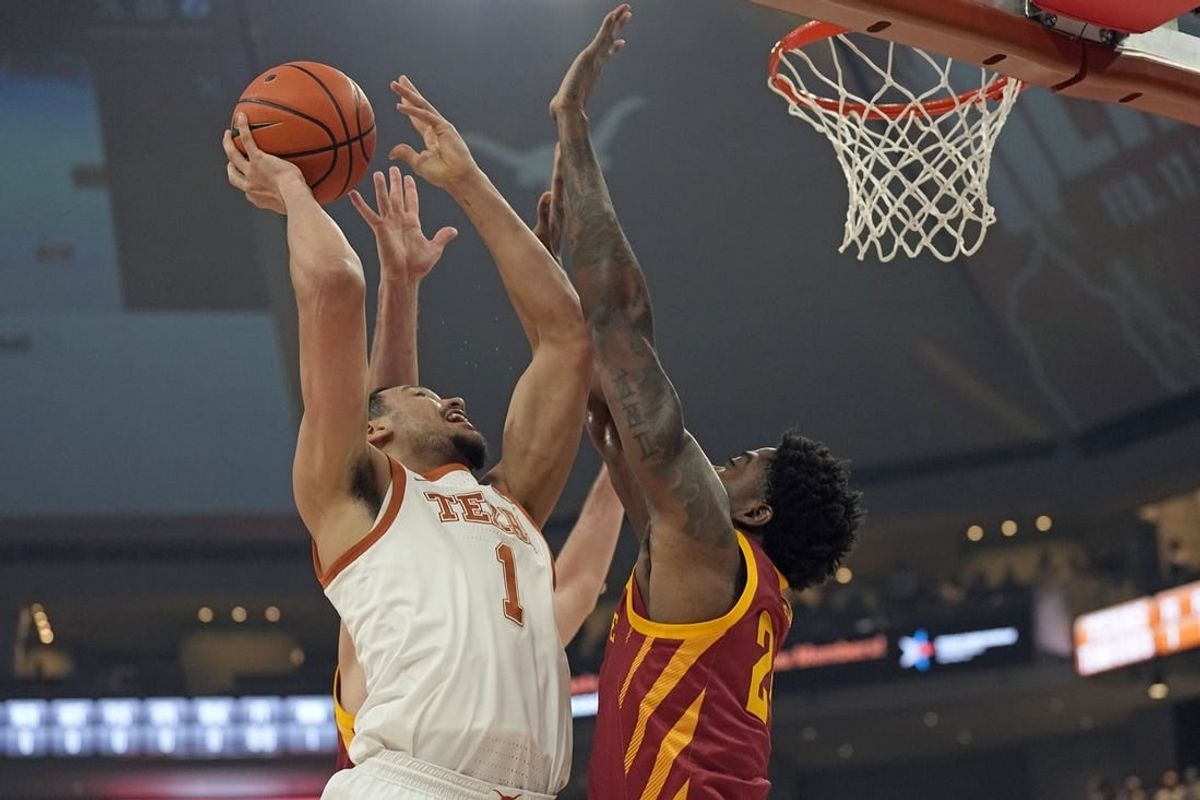 Feb 6, 2024; Austin, Texas, USA; Texas Longhorns forward Dylan Disu (1) shoots over Iowa State Cyclones forward Hason Ward (24) during the first half at Moody Center.