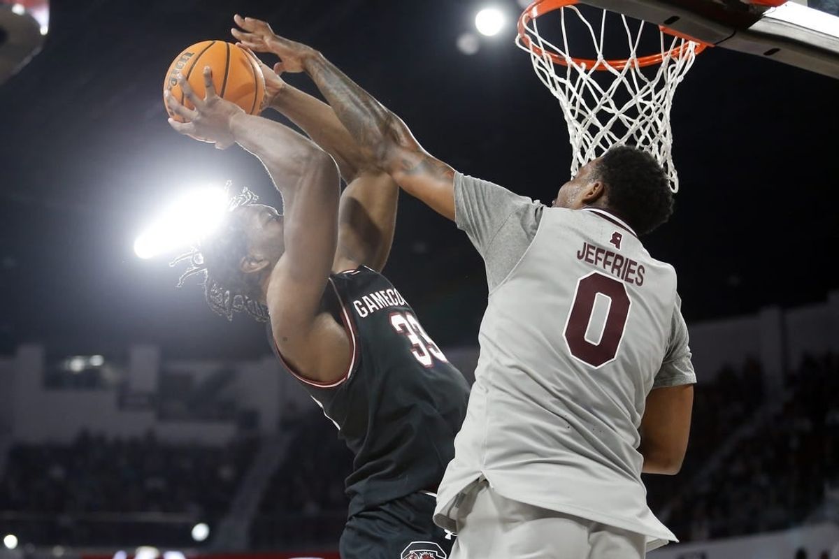 Mar 9, 2024; Starkville, Mississippi, USA; South Carolina Gamecocks forward Josh Gray (33) shoots as Mississippi State Bulldogs forward D.J. Jeffries (0) defends during the first half at Humphrey Coliseum.
