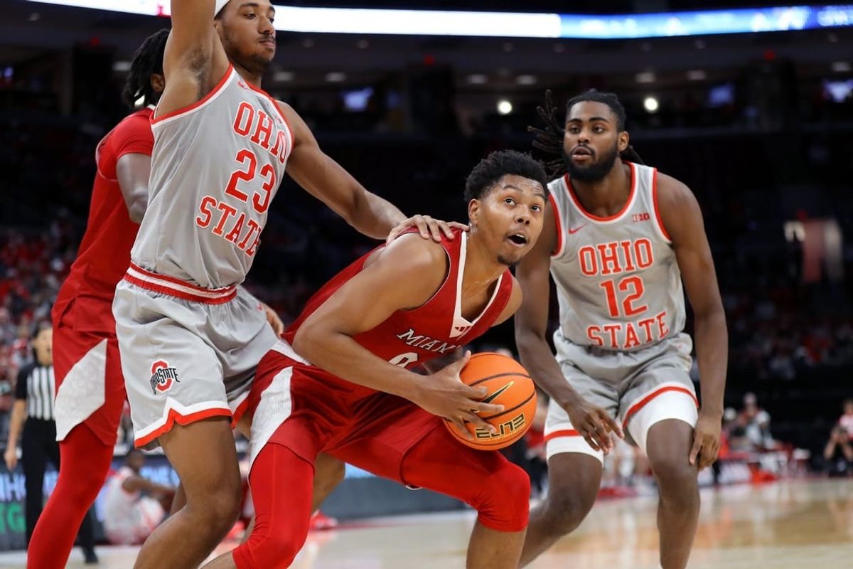 Dec 6, 2023; Columbus, Ohio, USA; Miami (Oh) Redhawks guard Eian Elmer (0) looks to score as Ohio State Buckeyes forward Zed Key (23) and guard Evan Mahaffey (12) defend during the first half at Value City Arena.