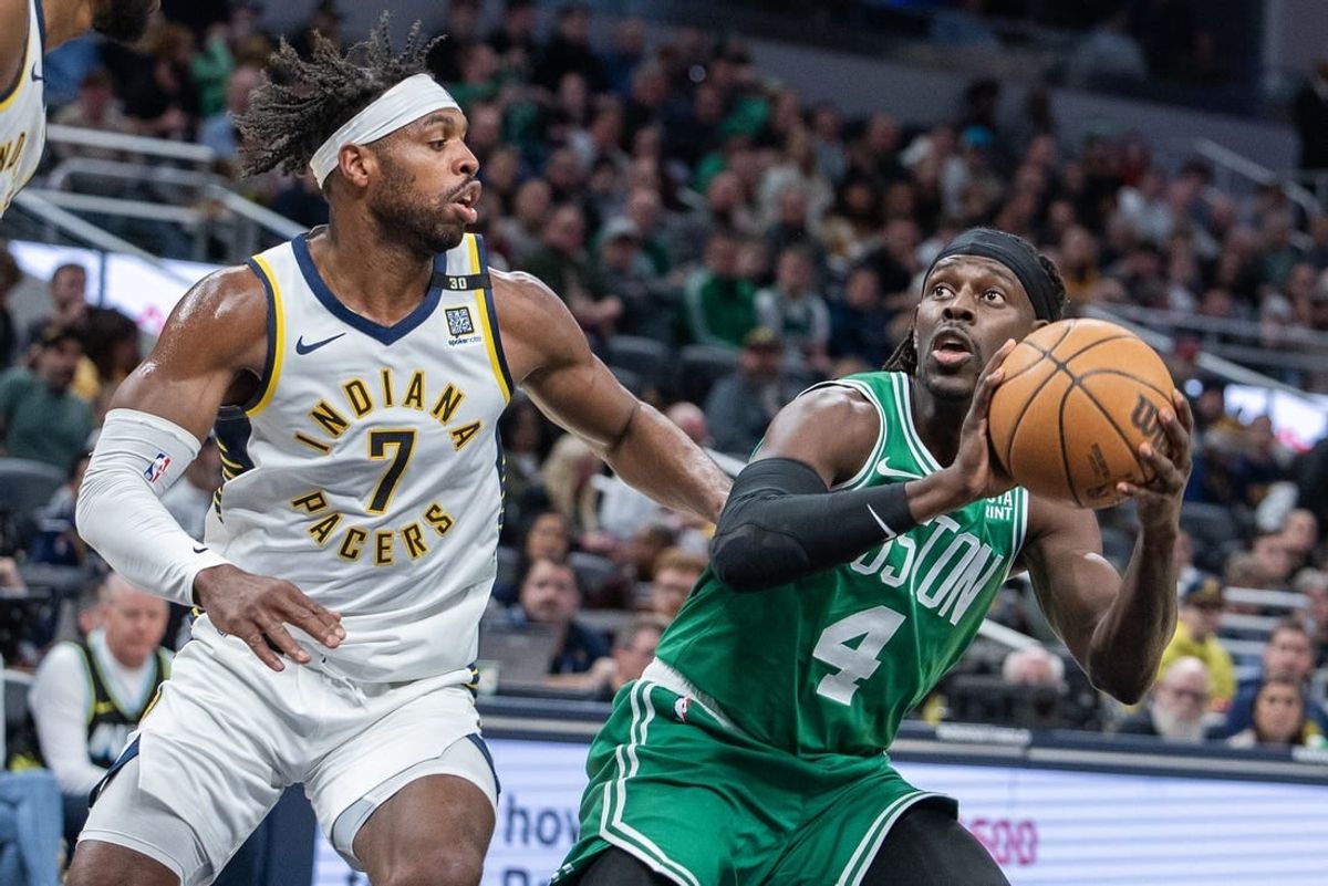 Jan 8, 2024; Indianapolis, Indiana, USA; Boston Celtics guard Jrue Holiday (4) shoots the ball while Indiana Pacers guard Buddy Hield (7) defends in the first half at Gainbridge Fieldhouse.
