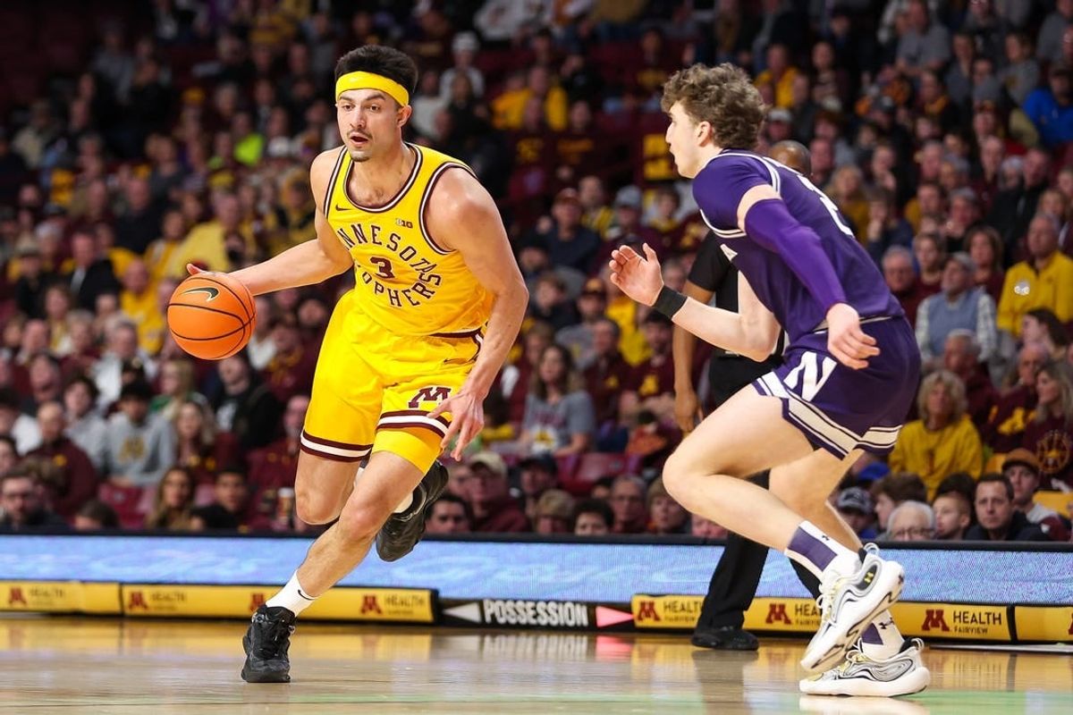 Feb 3, 2024; Minneapolis, Minnesota, USA; Minnesota Golden Gophers forward Dawson Garcia (3) works around Northwestern Wildcats forward Nick Martinelli (2) during the first half at Williams Arena.