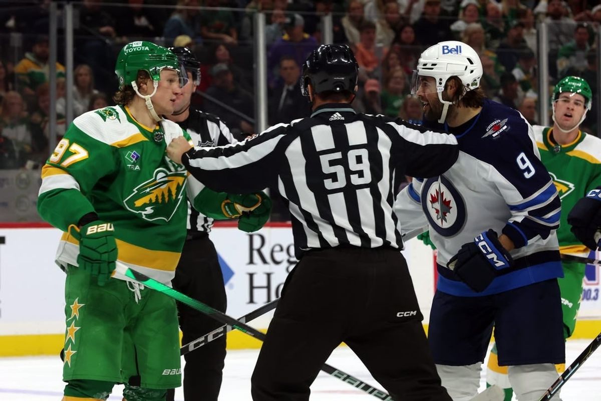 Apr 6, 2024; Saint Paul, Minnesota, USA; Winnipeg Jets left wing Alex Iafallo (9) is separated from Minnesota Wild left wing Kirill Kaprizov (97) during the second period at Xcel Energy Center.