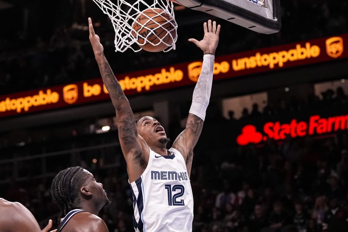 Dec 23, 2023; Atlanta, Georgia, USA; Memphis Grizzlies guard Ja Morant (12) dunks against the Atlanta Hawks during the second half  at State Farm Arena.